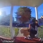 Woman falls through porch railing.