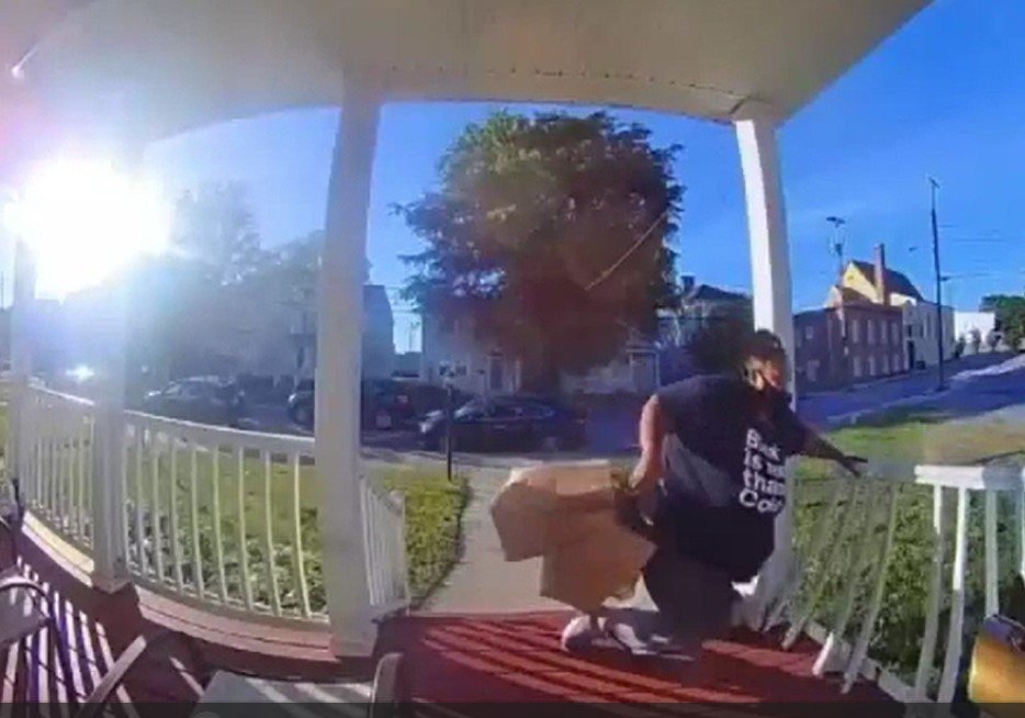 Woman falls through porch railing.